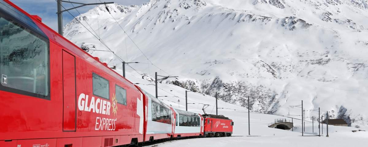 The Glacier Express near Naetschen close to Andermatt in Winter.