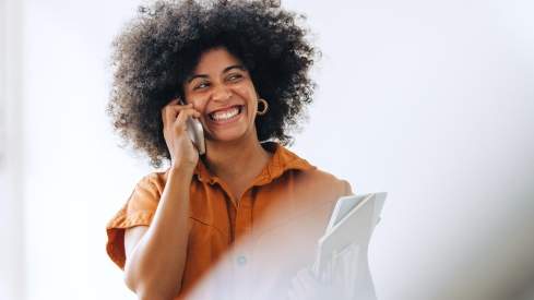 Woman in orange phoning